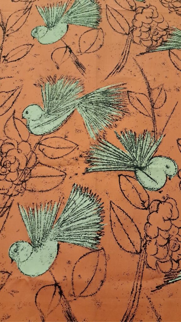 Althea McNish textile of birds in orange and verdigris.