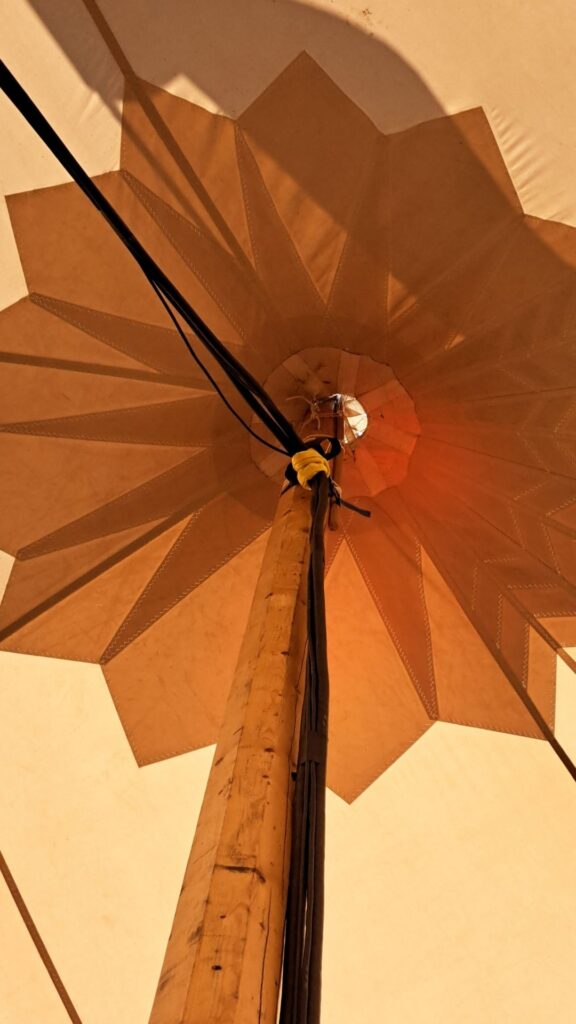 Geometric shape from the top of a circus tent in warm cream and terracotta colours.