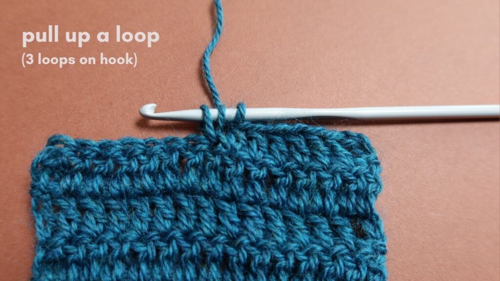 Close up of treble crochet stitch tutorial Step 4.