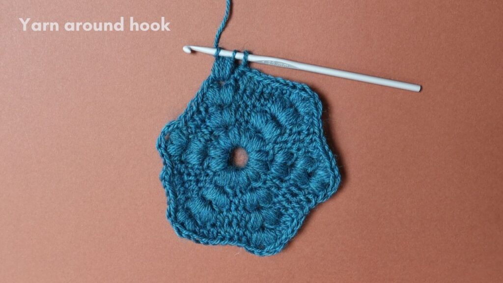 Puff Stitch crochet tutorial step 9 with a teal hexagon motif.