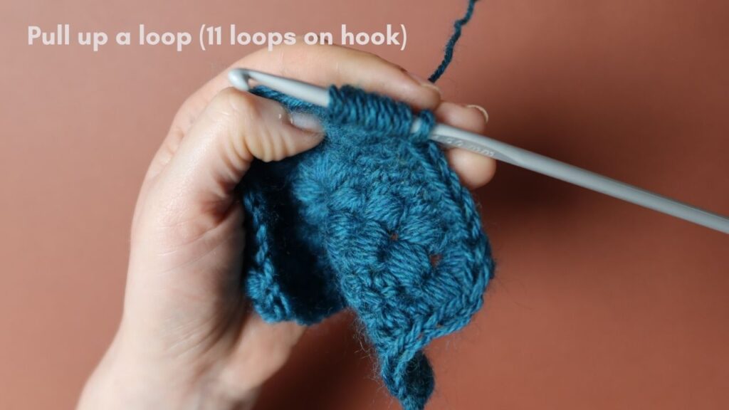 Puff Stitch crochet tutorial step 7 with a teal hexagon motif.