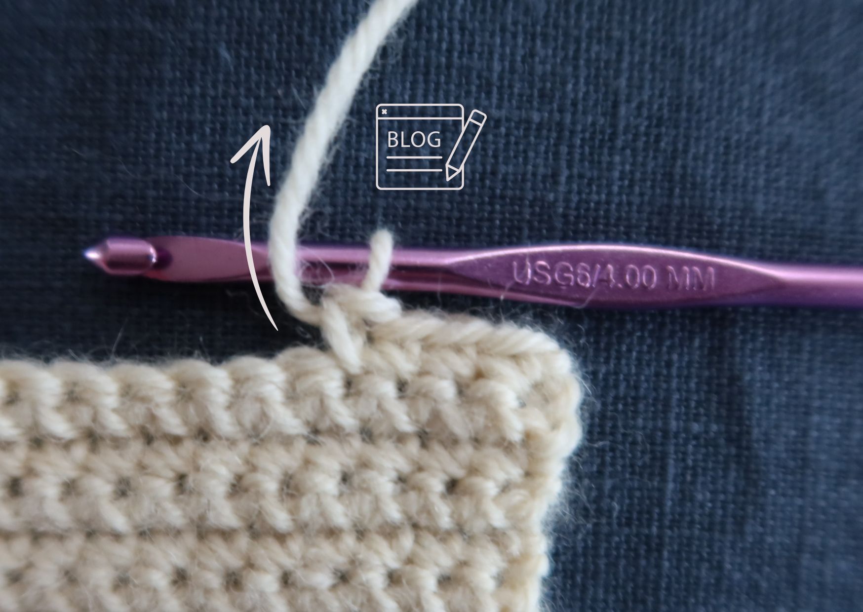 Swatch of cream yarn in double crochets with yarn unders and pink hook.