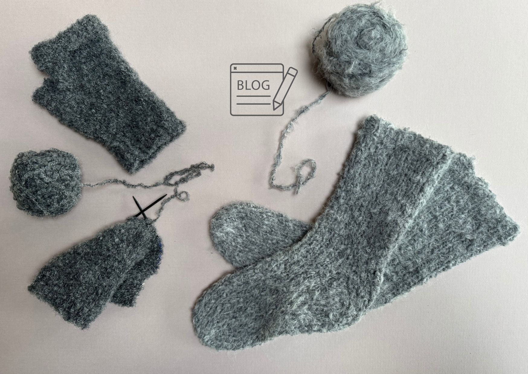 Bed socks knitted from light grey soft boucle yarn with partially knitted dark grey loop boucle fingerless mittens.