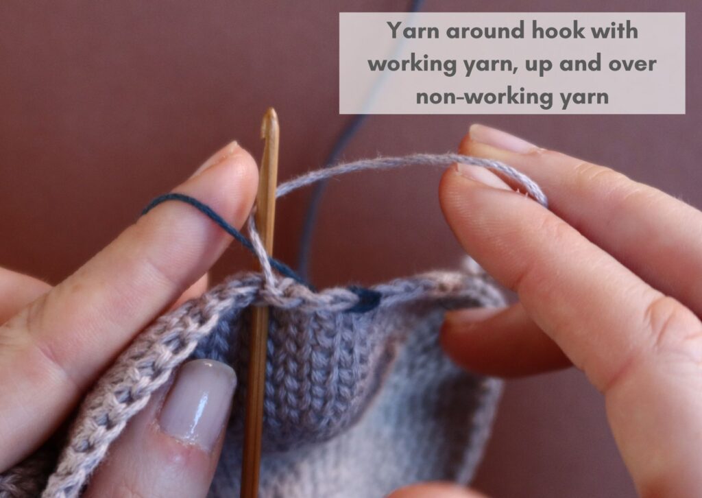 Waistcoat stitch fabric being worked in the round with the non-working yarn trapped down and more stitches made with working yarn.