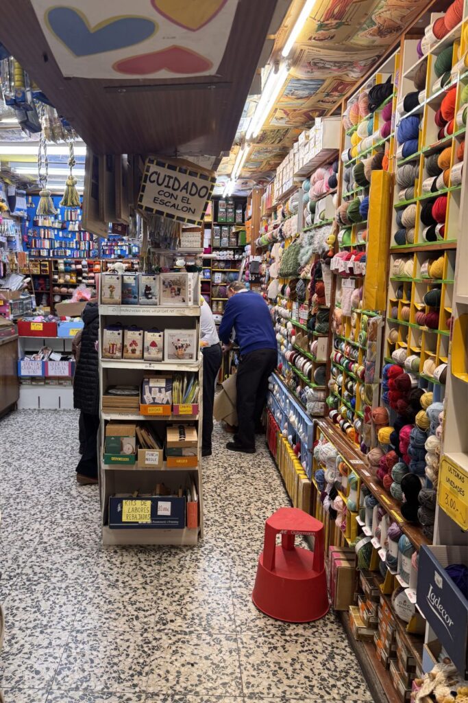Inside of Almacen yarn shop in Madrid with counters. 