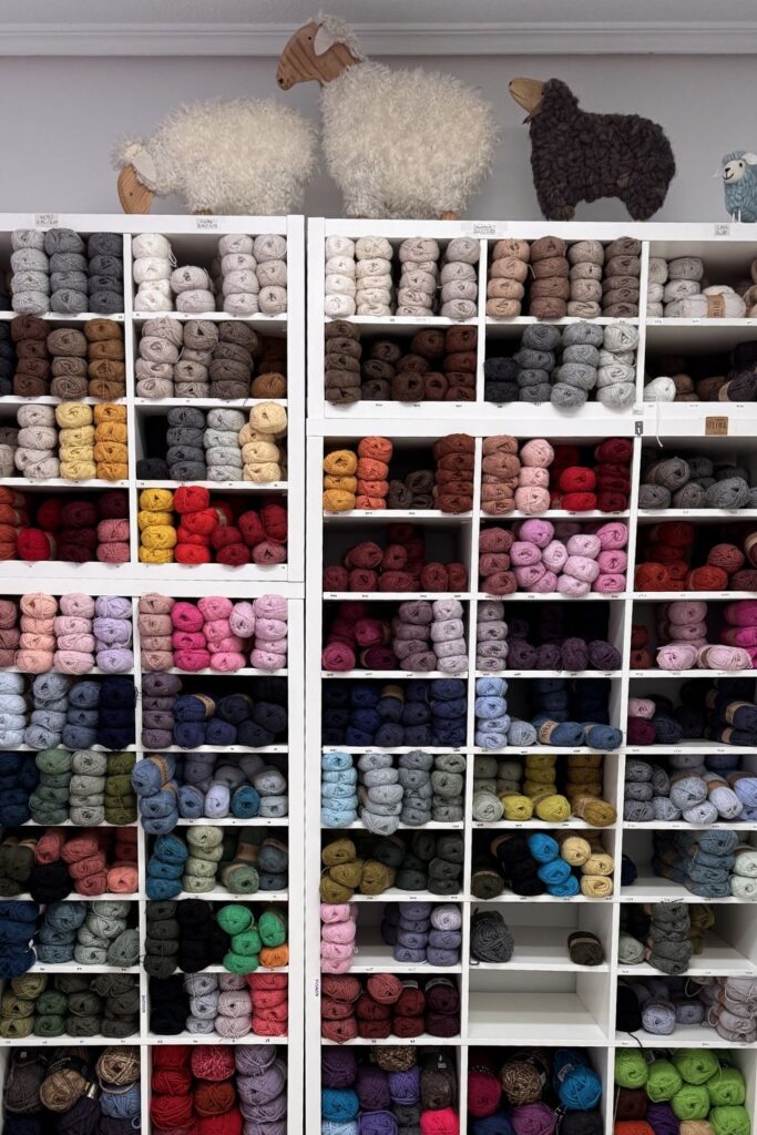 Shelves full of colourful yarn.