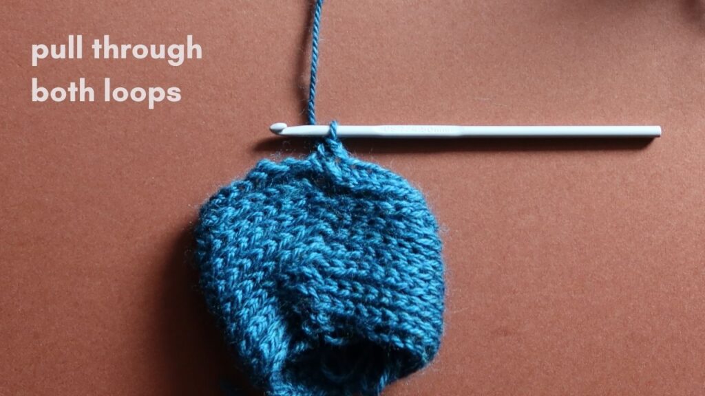 Close up of a starting half treble crochet in the third loop.