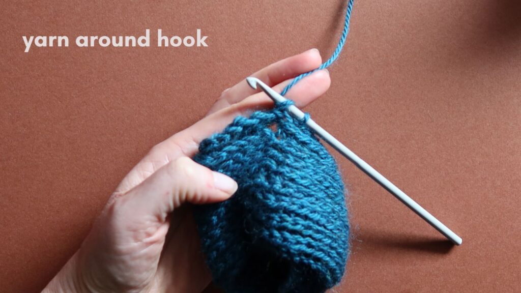 Close up of a starting half treble crochet in the third loop.