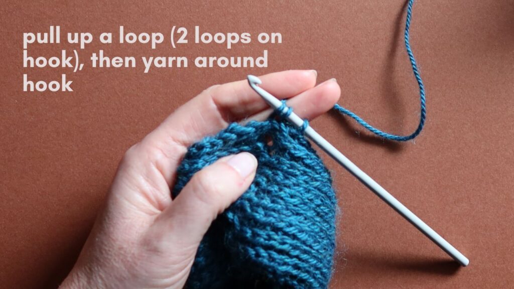 Close up of a starting half treble crochet in the third loop.