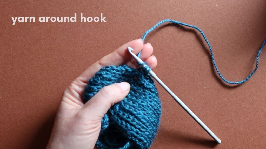 Close up of a starting half treble crochet in the third loop.