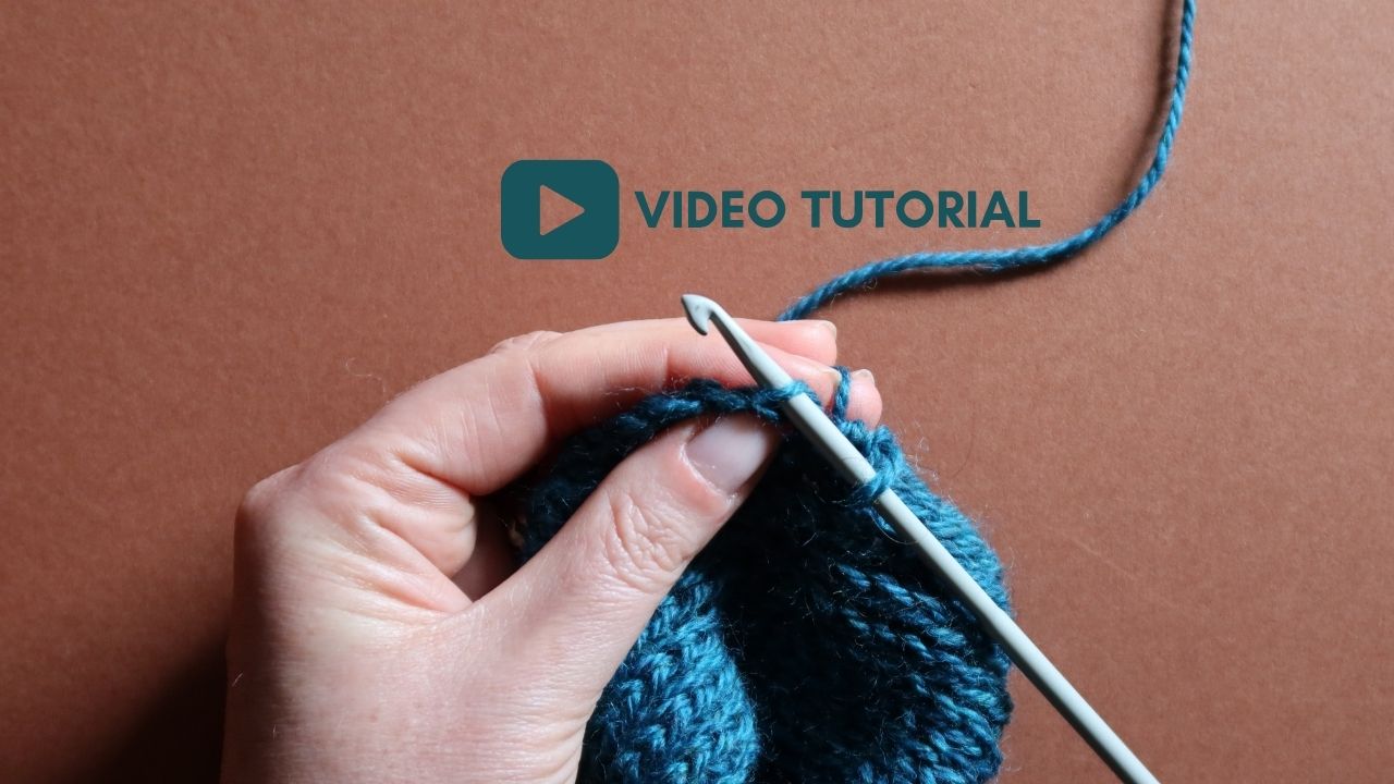 Close up of a starting half treble crochet in the third loop with 'Video Tutorial" text overlay.