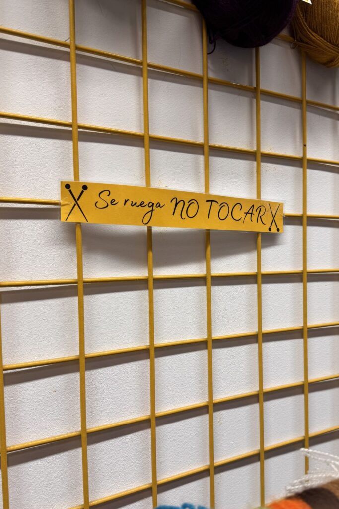 DO NOT TOUCH SIGN in Lanas El Gato Negro, Madrid.