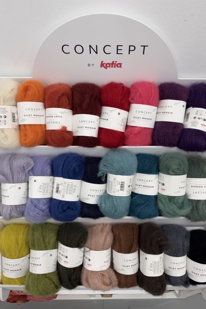 Lots of colourful balls of Katia mohair yarn.