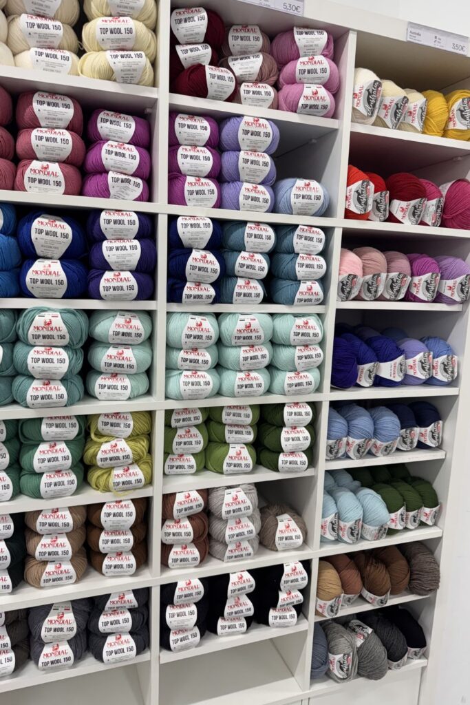 Shelves fo colourful yarn by Mondial.