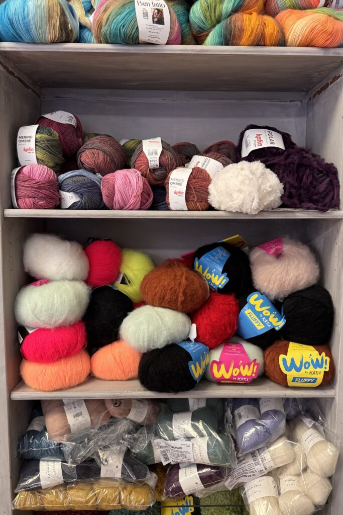 Shelves of colourful balls of yarn.