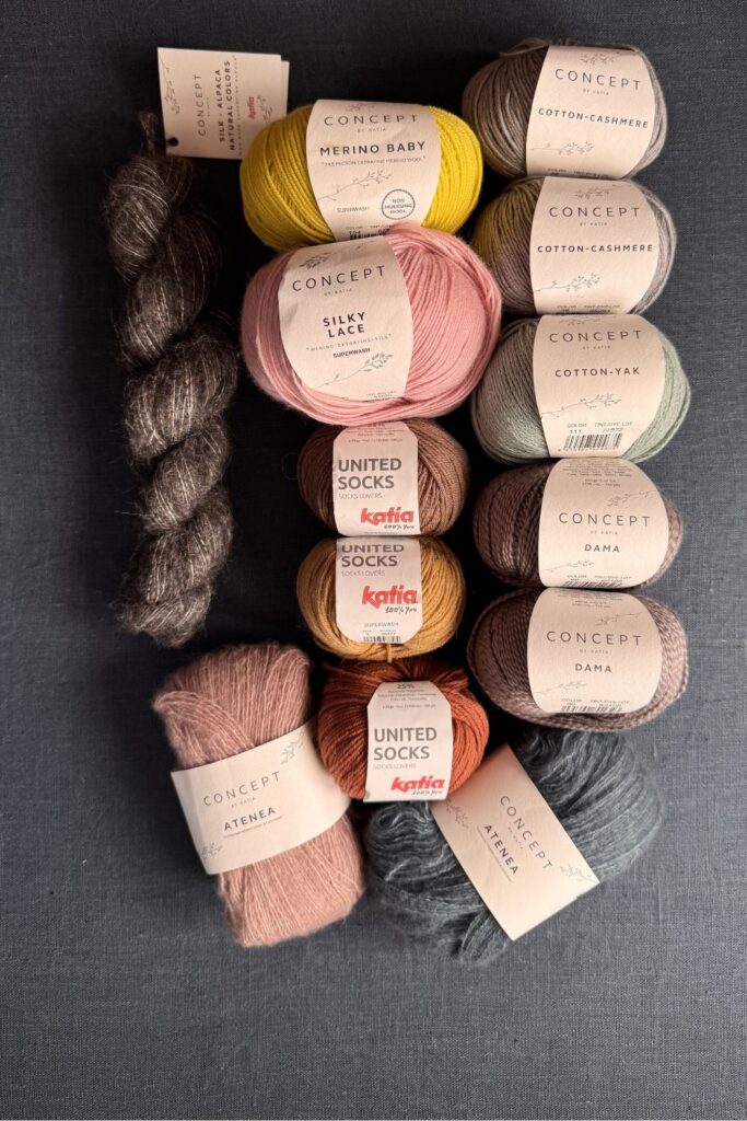 Balls and skeins of Katia yarn in lots of colours.
