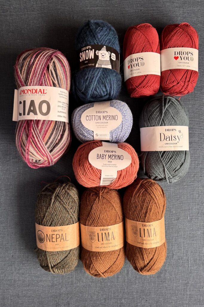 Lots of balls of Drops wool and yarn.