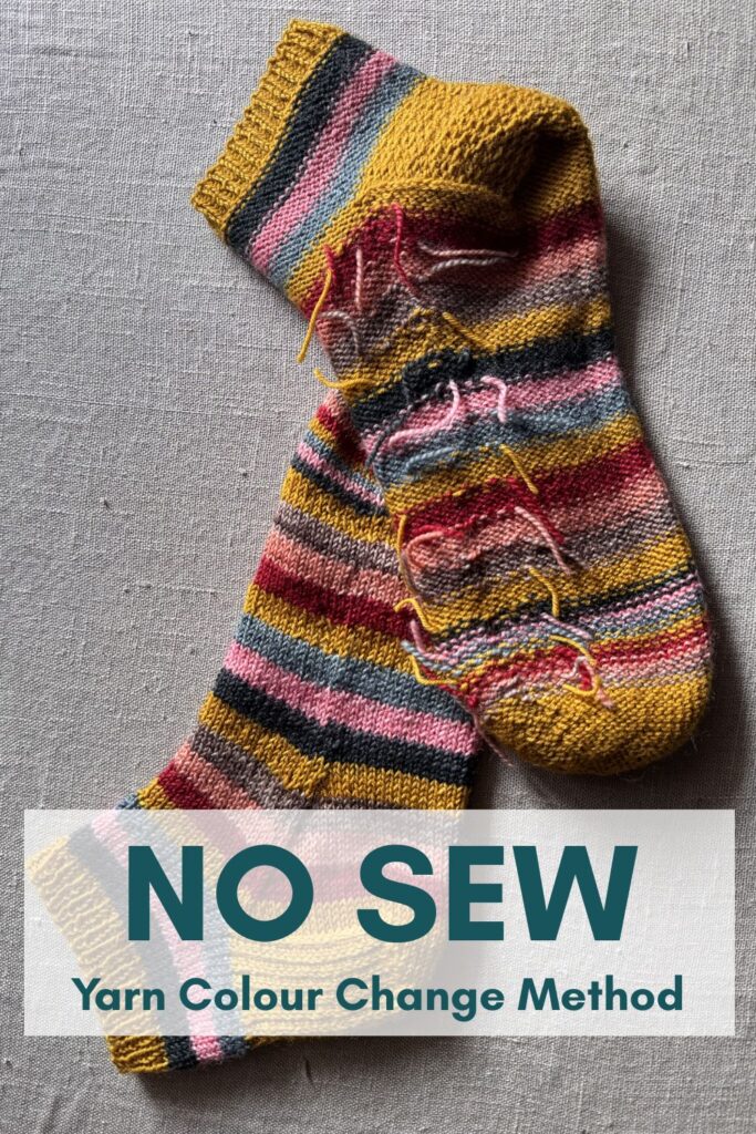 A pair of brightly coloured knitted striped trainer socks with no sew coloured yarn join method.