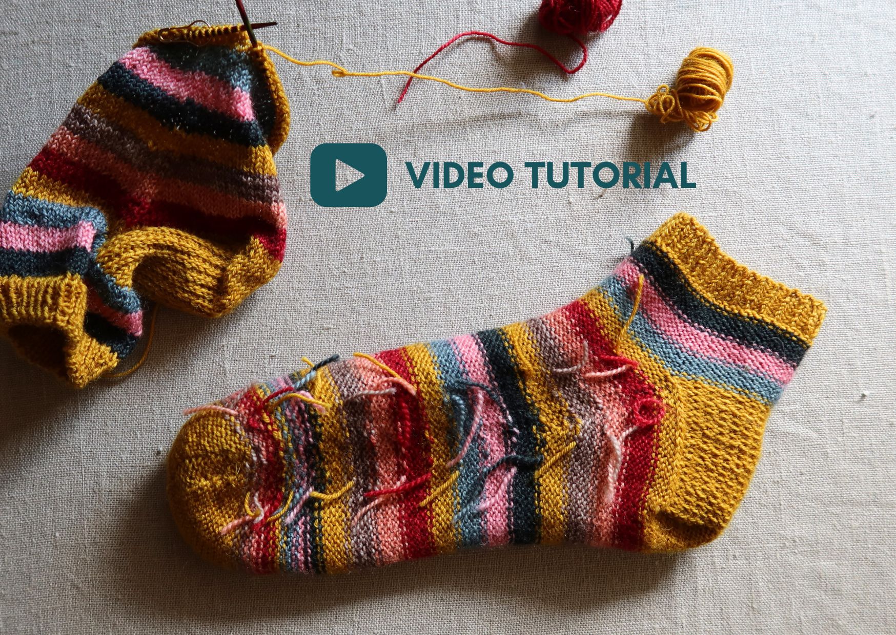 Knitted sock showing how to join new yarn colours without weaving in ends.